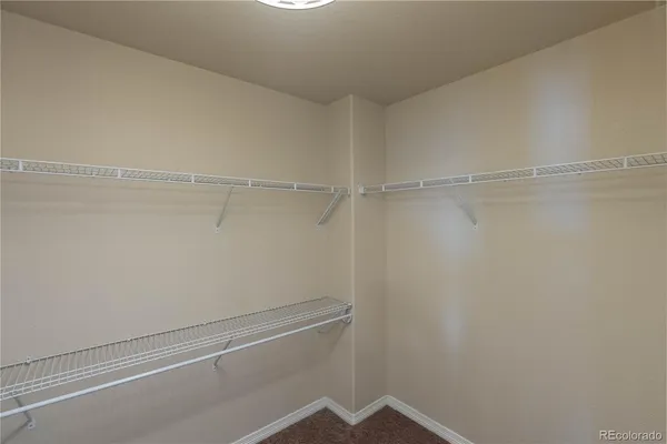 a view of an empty walk in closet