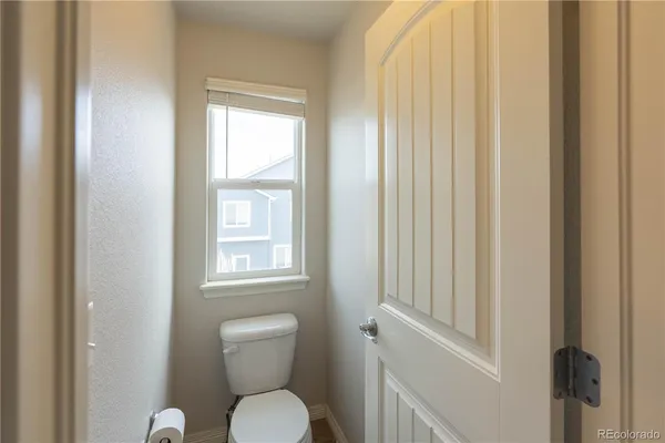 a bathroom with a toilet and a sink