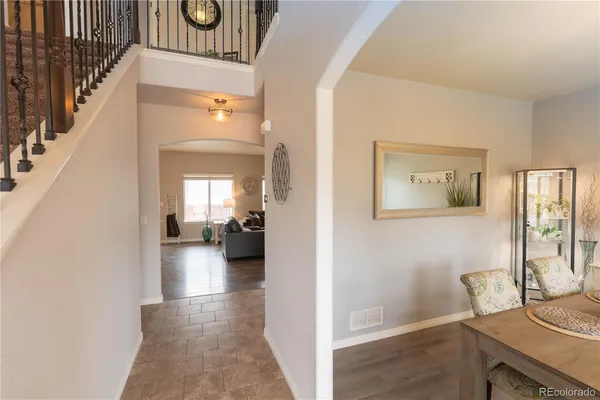 a view of a hallway that has hardwood floor