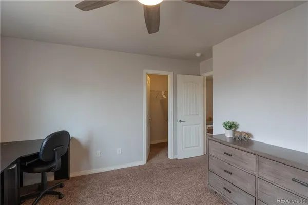 a room with cabinets and chair