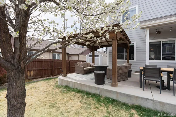 a view of a house with backyard and porch