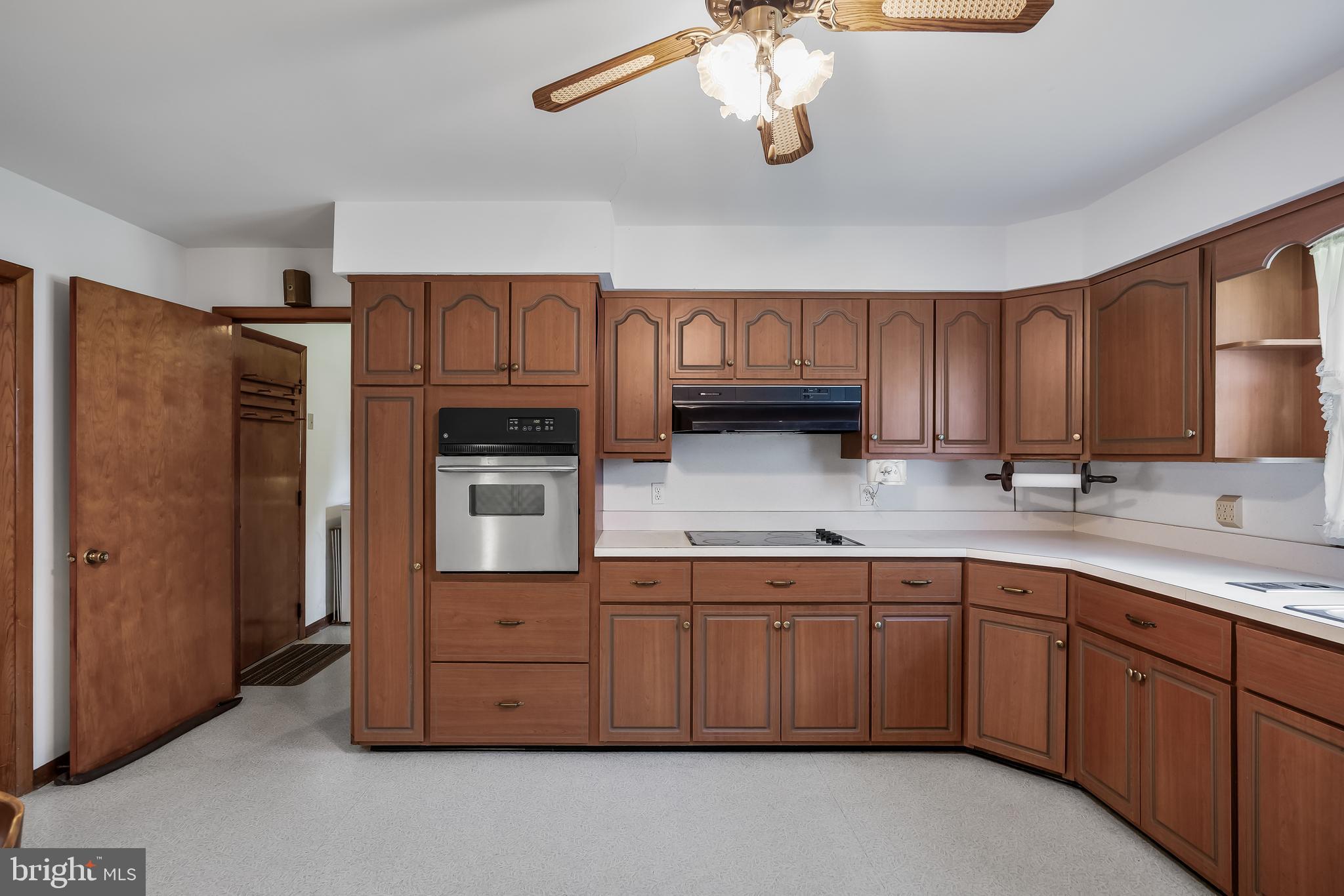44 Supawna Road Pennsville, NJ 08070 - Photo 13 of 56 a kitchen with a sink stainless steel appliances cabinets and a window