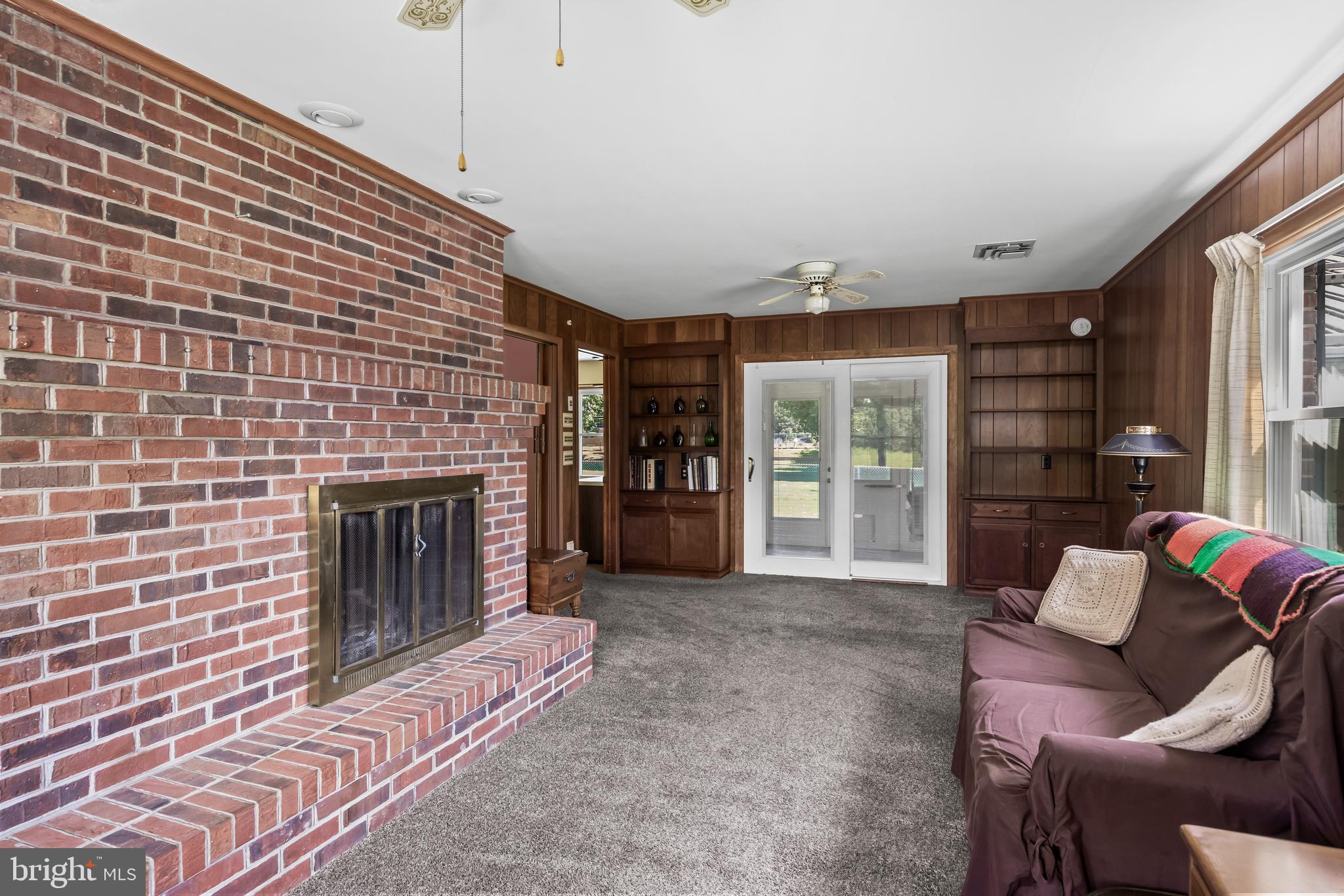 44 Supawna Road Pennsville, NJ 08070 - Photo 18 of 56 a living room with furniture and a fireplace