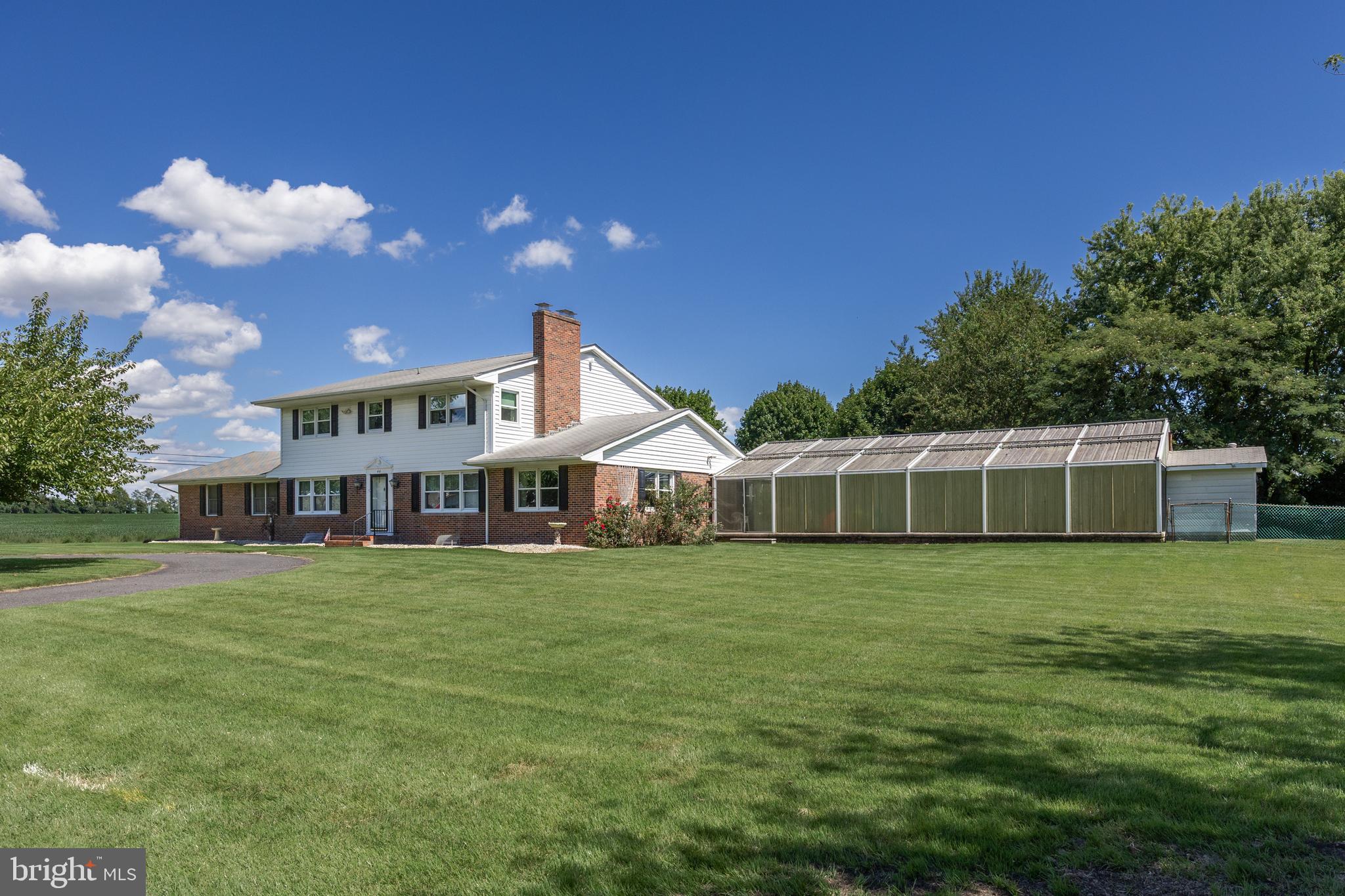 44 Supawna Road Pennsville, NJ 08070 - Photo 2 of 56 a front view of a house with a garden