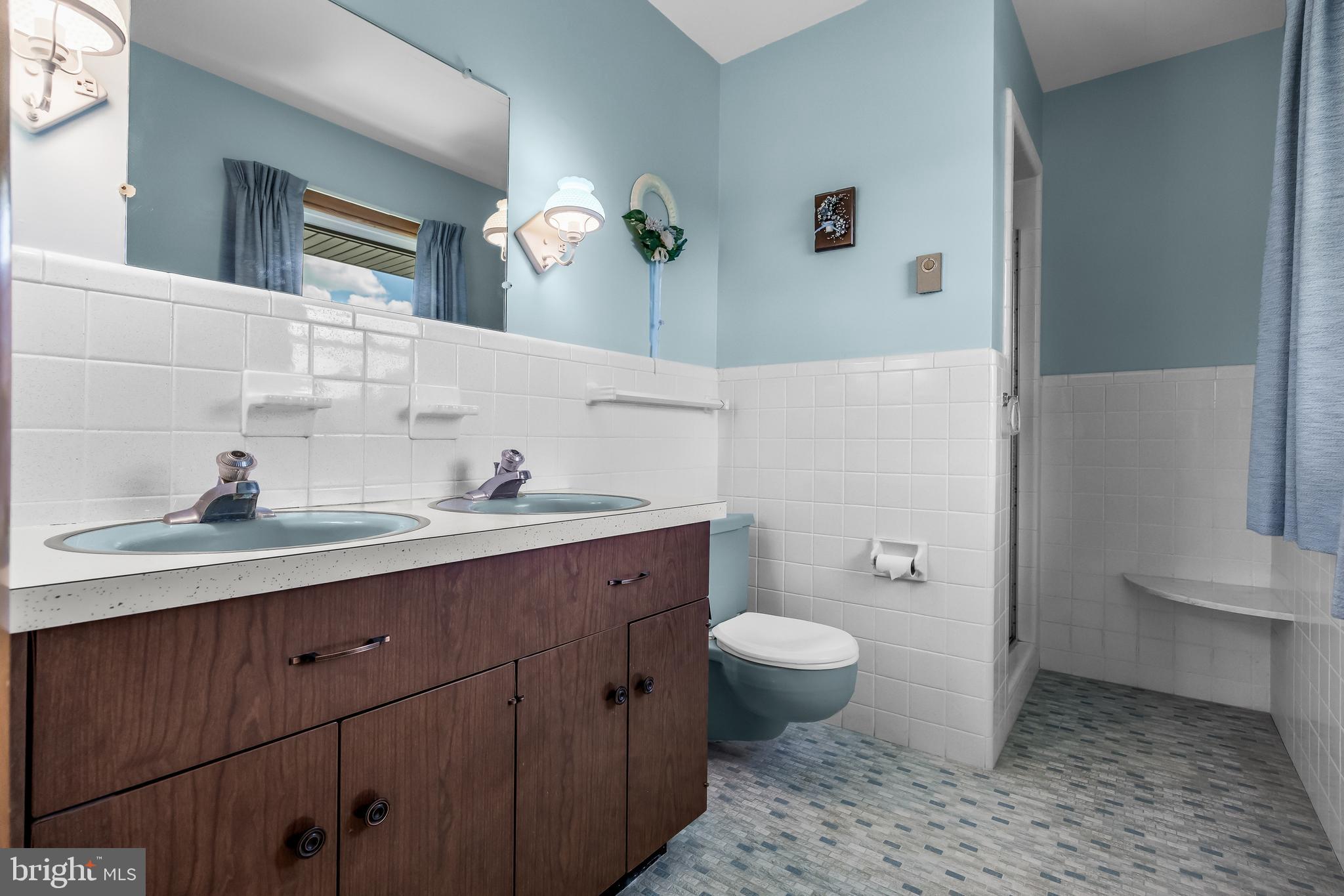 44 Supawna Road Pennsville, NJ 08070 - Photo 28 of 56 a bathroom with a granite countertop sink a toilet and a mirror