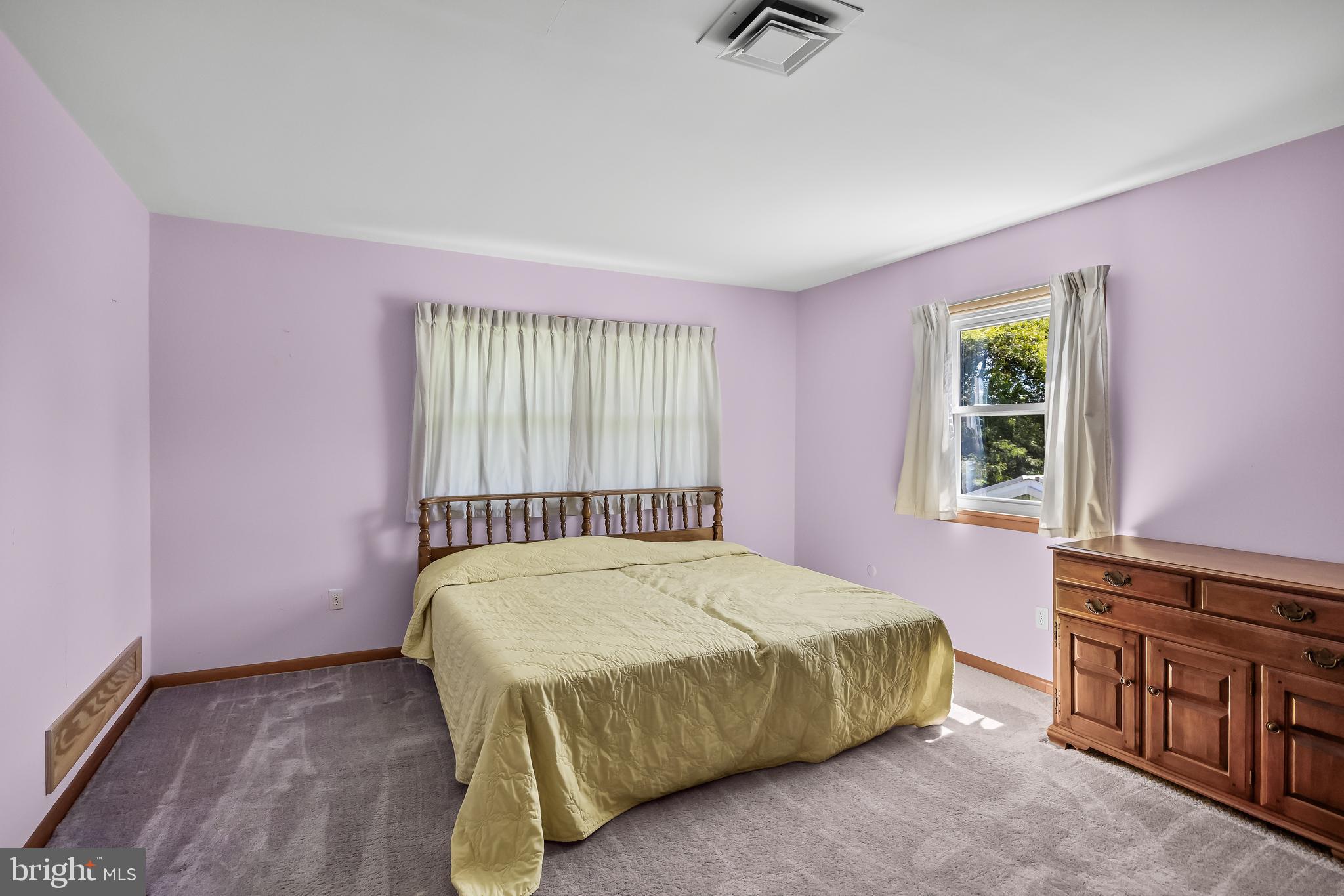 44 Supawna Road Pennsville, NJ 08070 - Photo 29 of 56 a bed sitting in a room next to a window