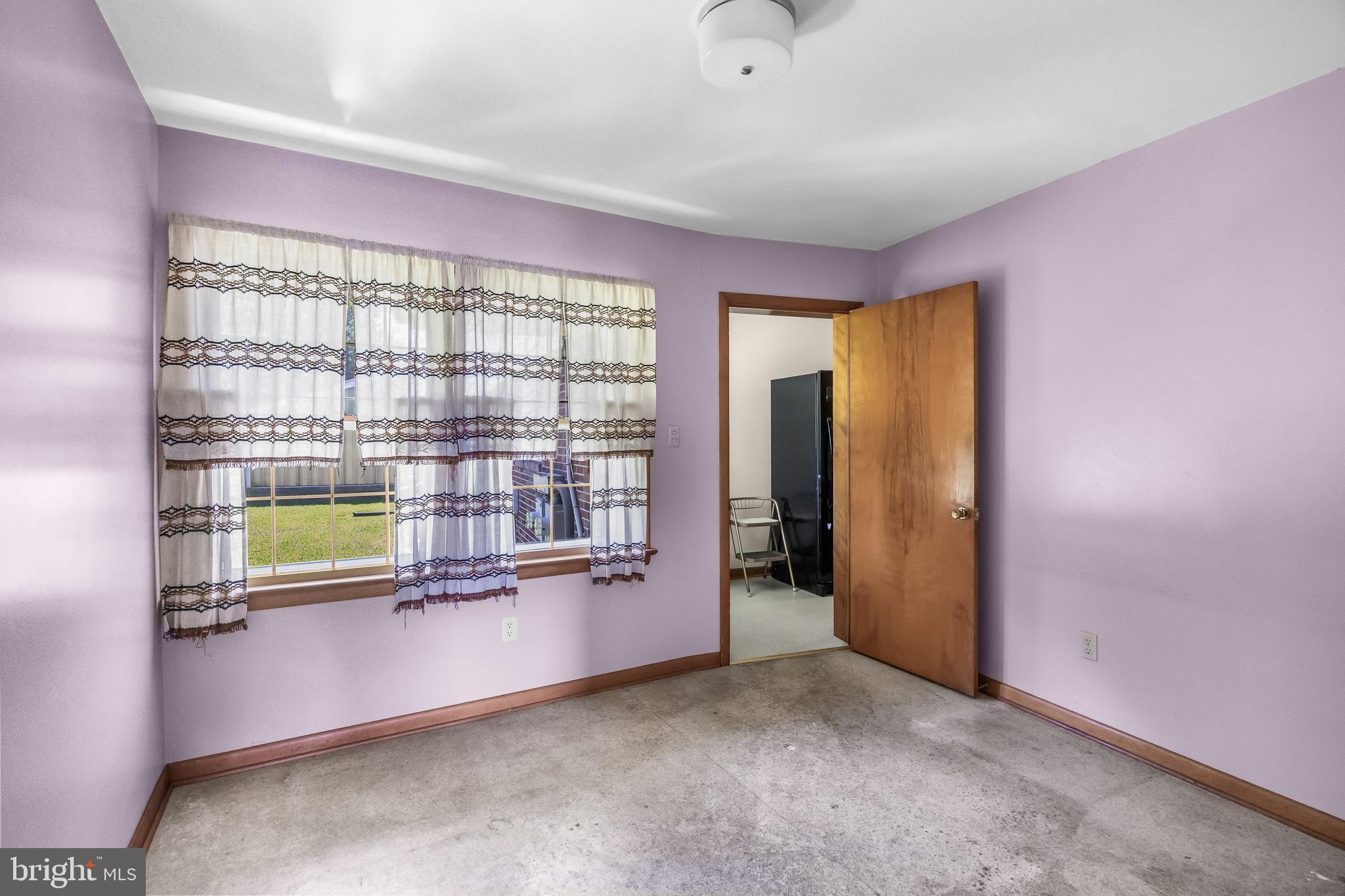44 Supawna Road Pennsville, NJ 08070 - Photo 42 of 56 an empty room with kitchen view and a natural light