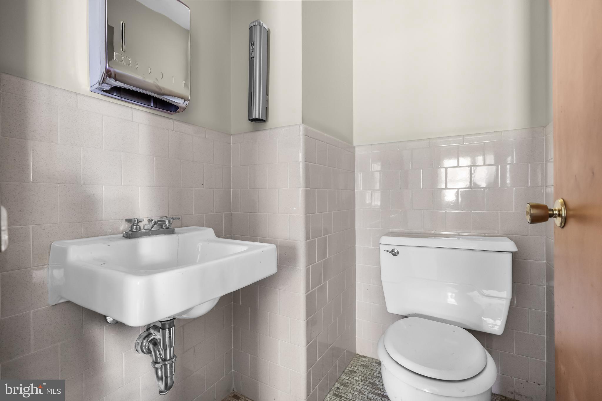 44 Supawna Road Pennsville, NJ 08070 - Photo 43 of 56 a bathroom with a toilet sink and mirror