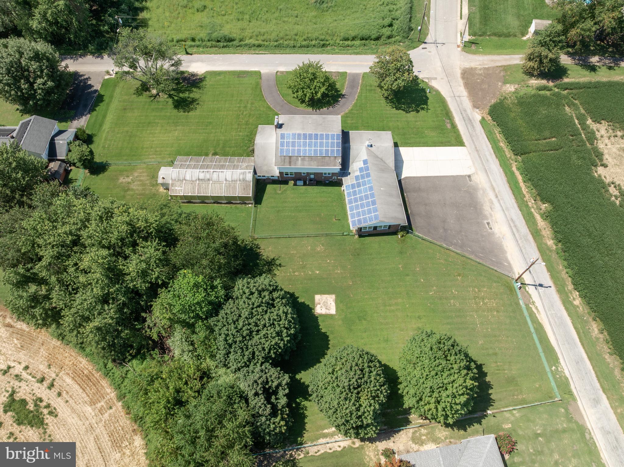 44 Supawna Road Pennsville, NJ 08070 - Photo 52 of 56 an aerial view of a house with a garden and swimming pool