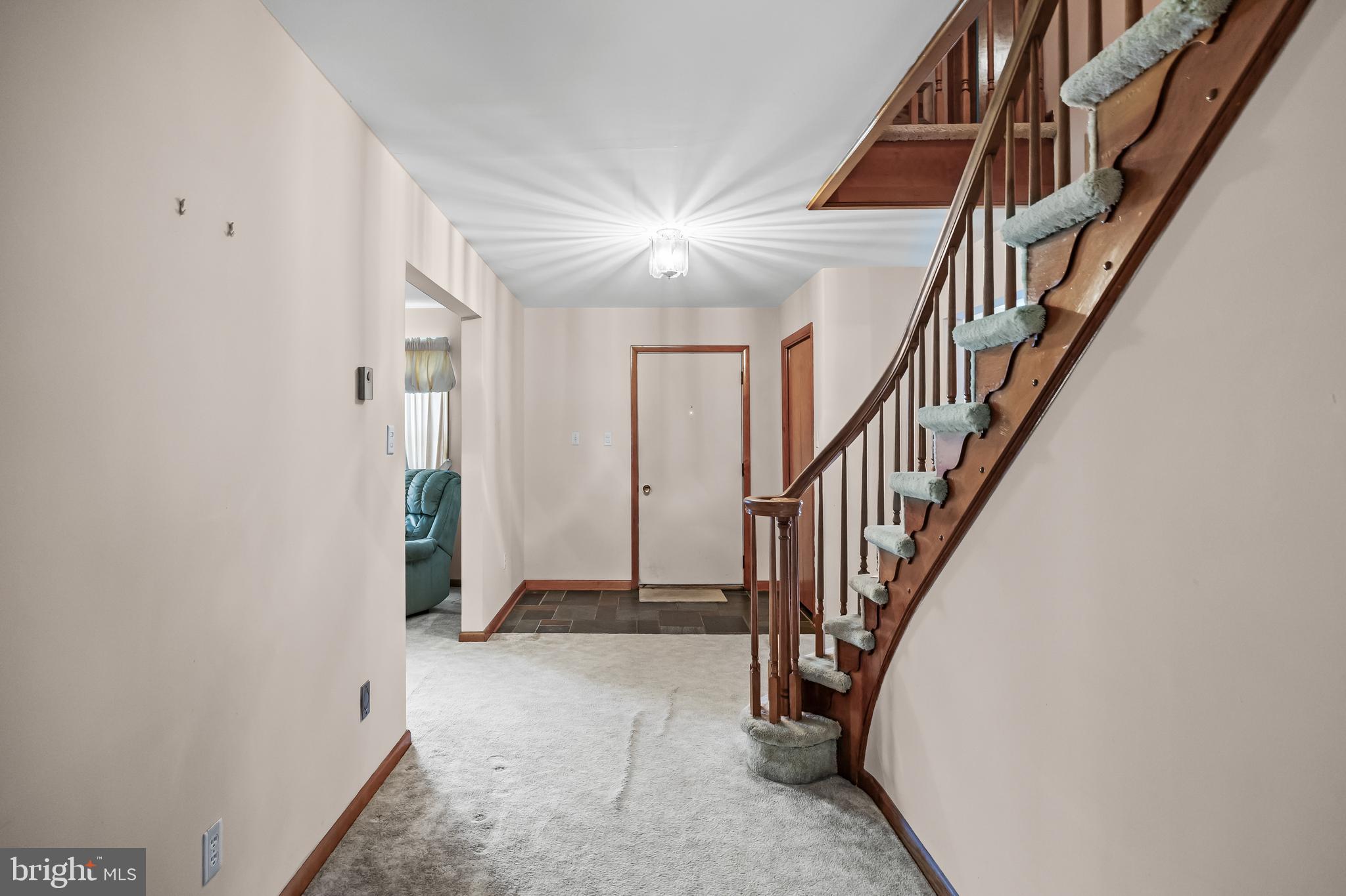 44 Supawna Road Pennsville, NJ 08070 - Photo 6 of 56 a view of entryway with wooden floor and stairs