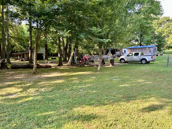 a front view of a building with parked cars