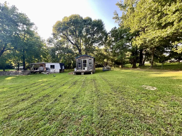a view of a trees in front of a house