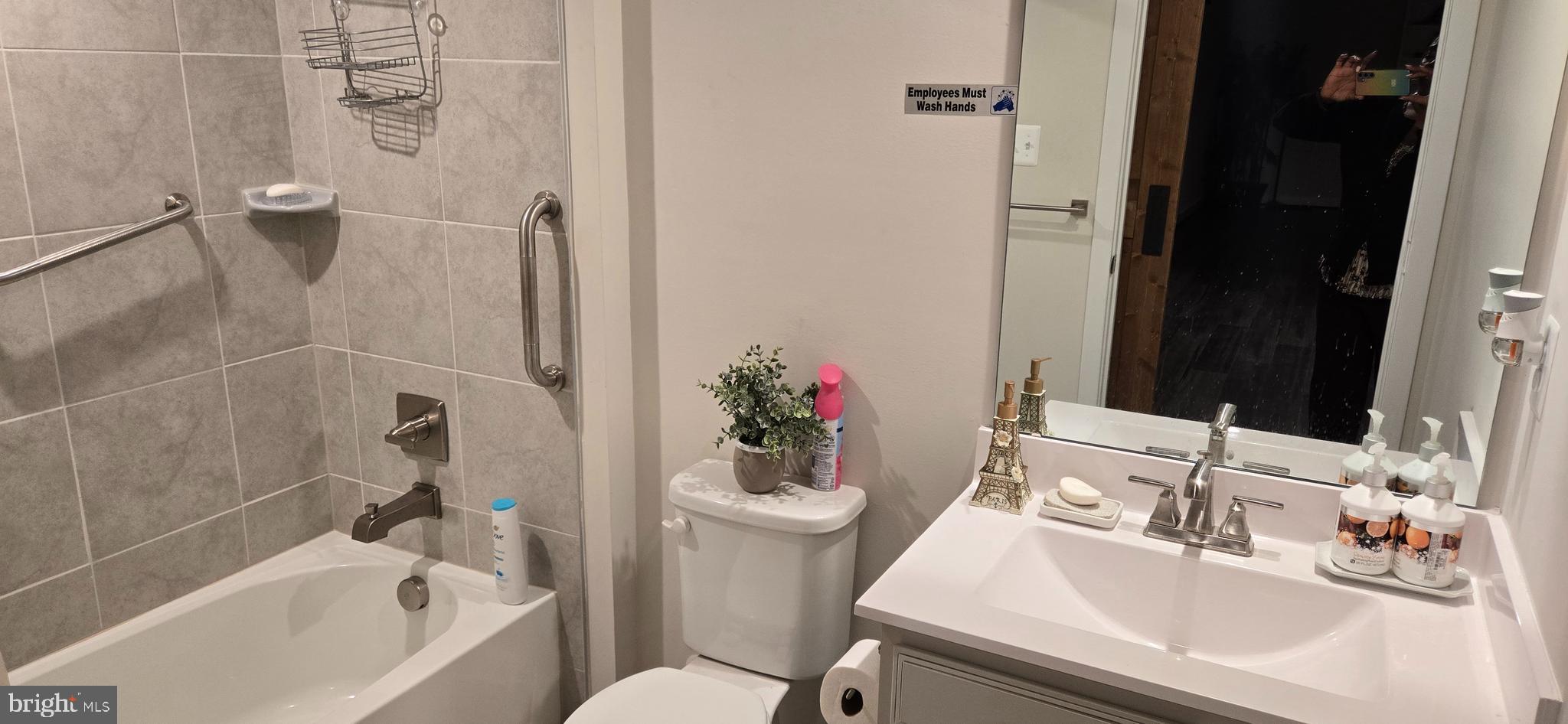 6005 Calla Place Frederick, MD 21703 - Photo 14 of 30 a bathroom with a sink toilet and shower