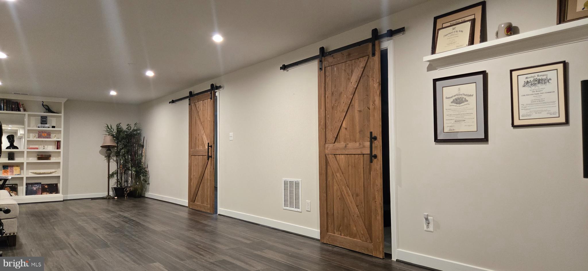 6005 Calla Place Frederick, MD 21703 - Photo 20 of 30 a view of livingroom with hardwood floor and hallway