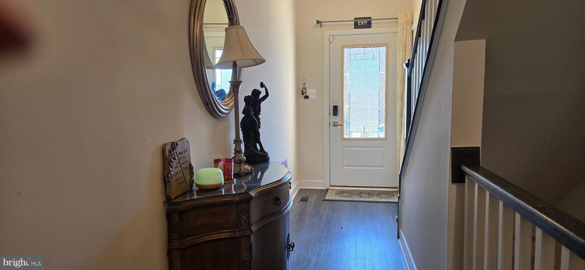 6005 Calla Place Frederick, MD 21703 - Photo 2 of 30 a view of a hallway with wooden floor and entryway