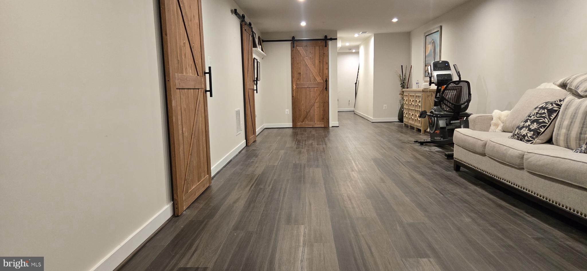 6005 Calla Place Frederick, MD 21703 - Photo 23 of 30 a living room with furniture and a wooden floor