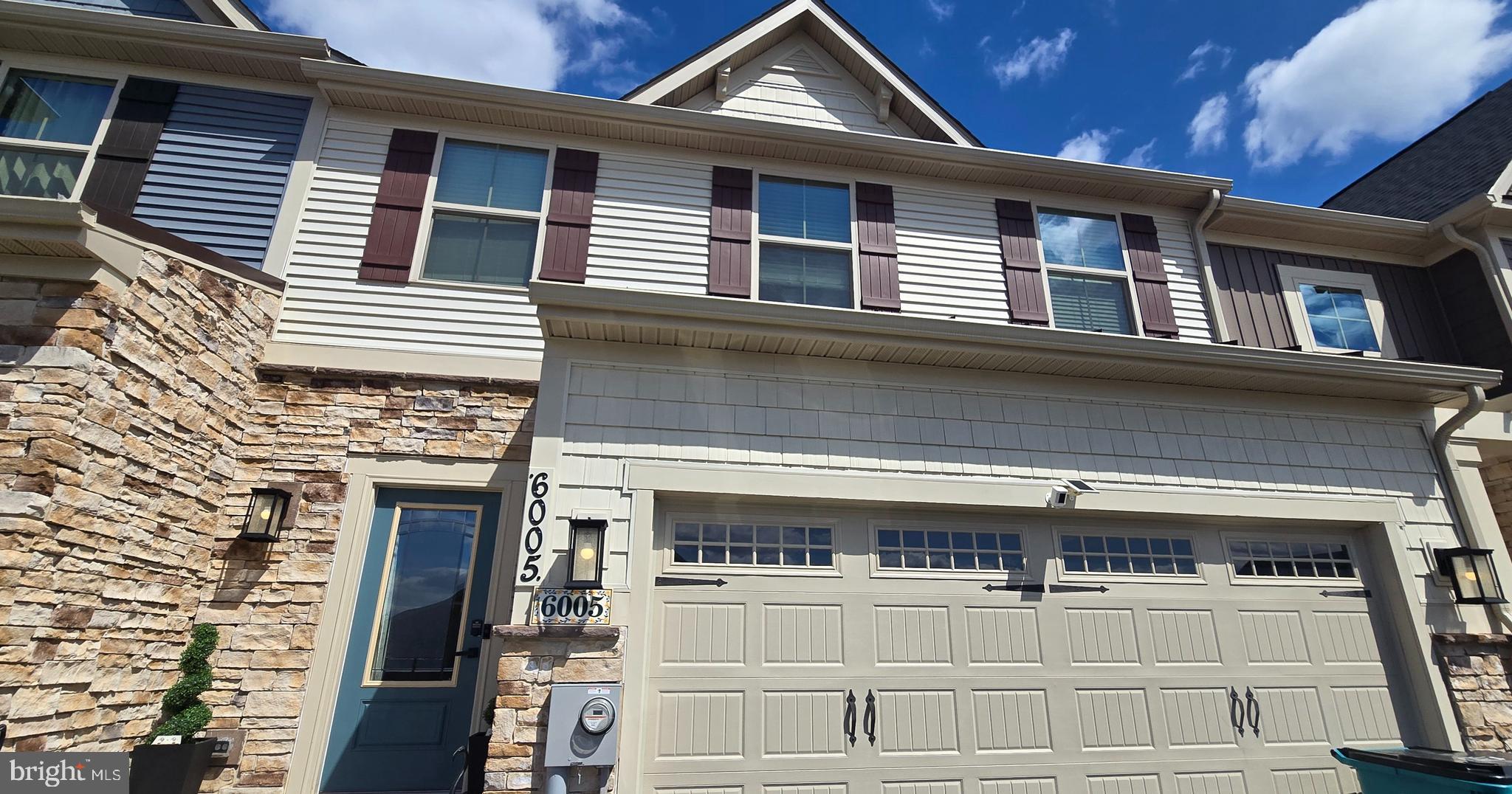 6005 Calla Place Frederick, MD 21703 - Photo 25 of 30 a front view of a house with a garage