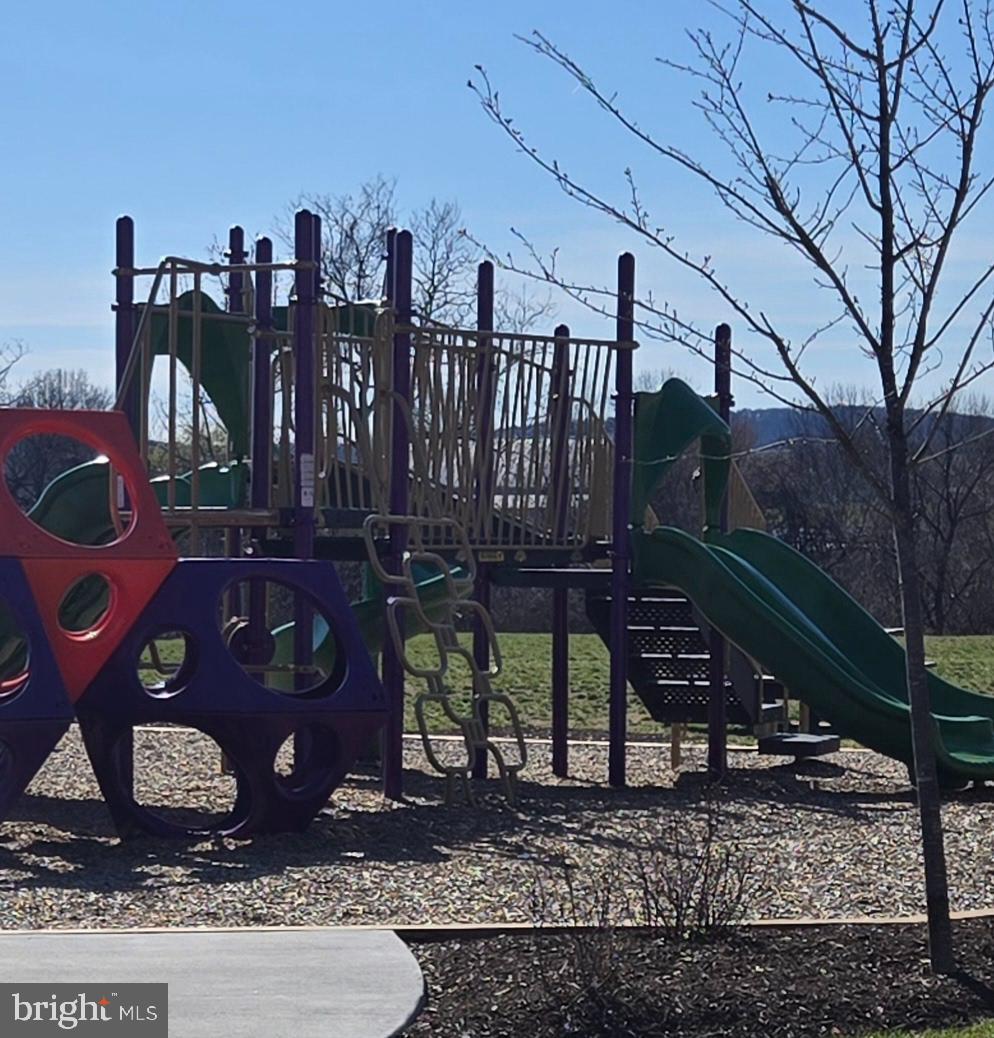 6005 Calla Place Frederick, MD 21703 - Photo 29 of 30 a view of a backyard with wooden fence