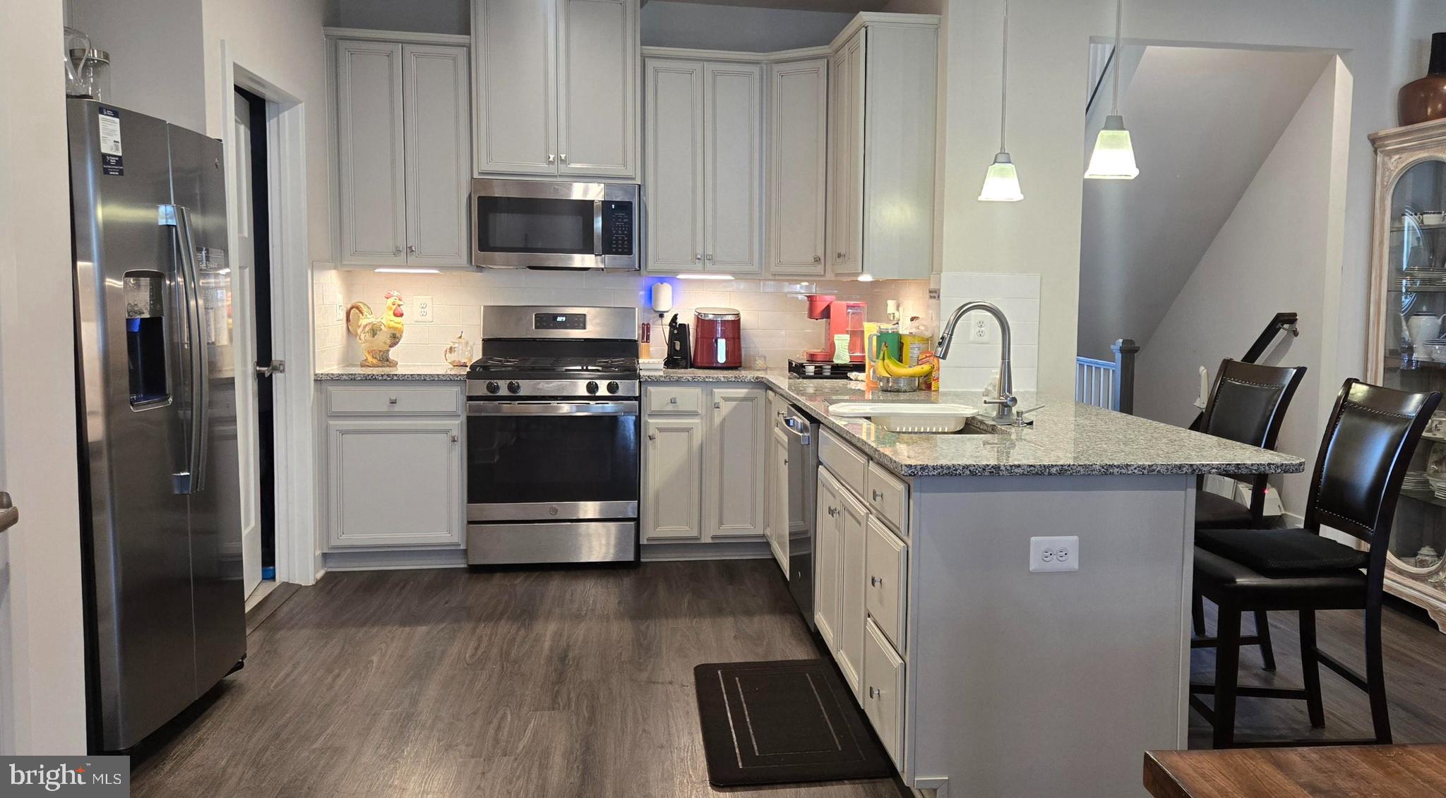6005 Calla Place Frederick, MD 21703 - Photo 5 of 30 a kitchen with a sink stove and refrigerator