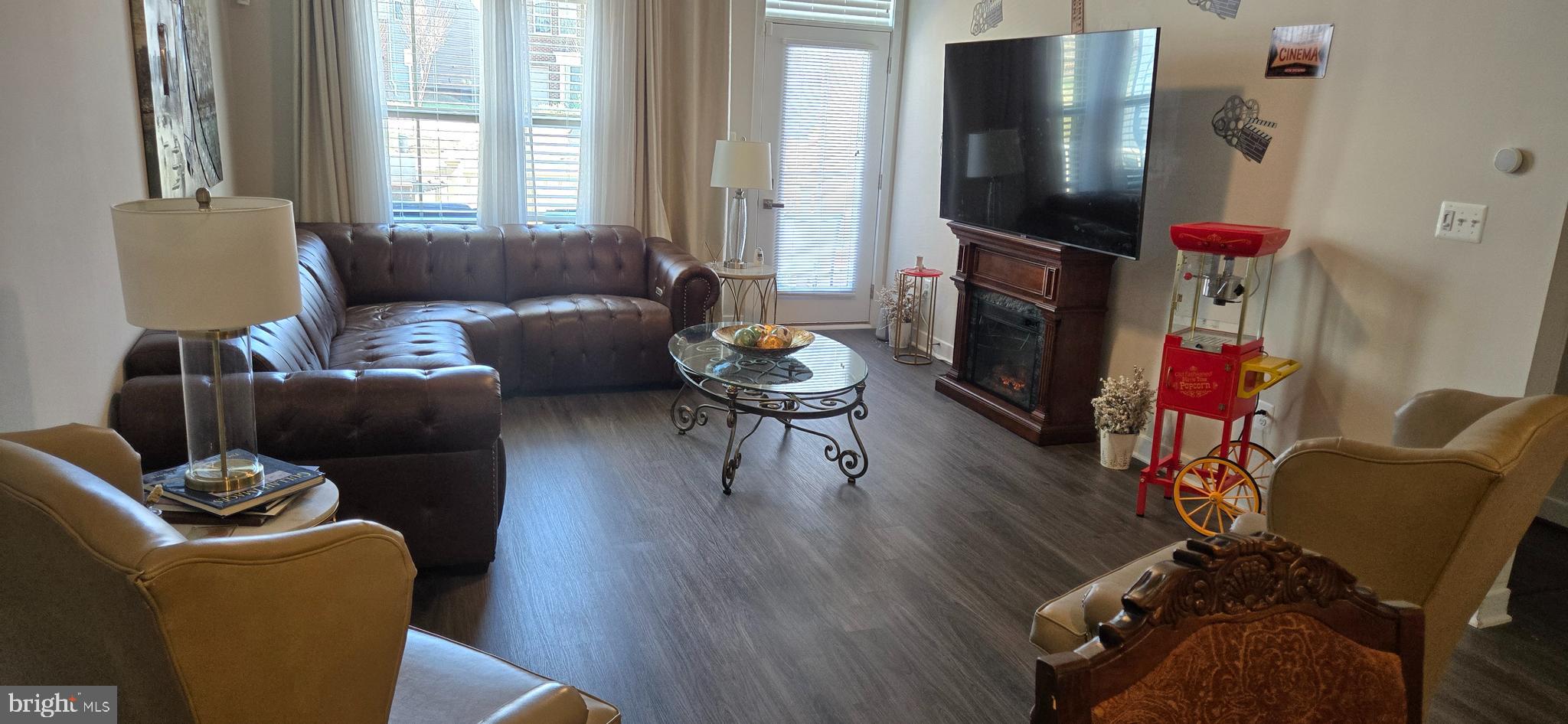 6005 Calla Place Frederick, MD 21703 - Photo 6 of 30 a living room with furniture and a flat screen tv