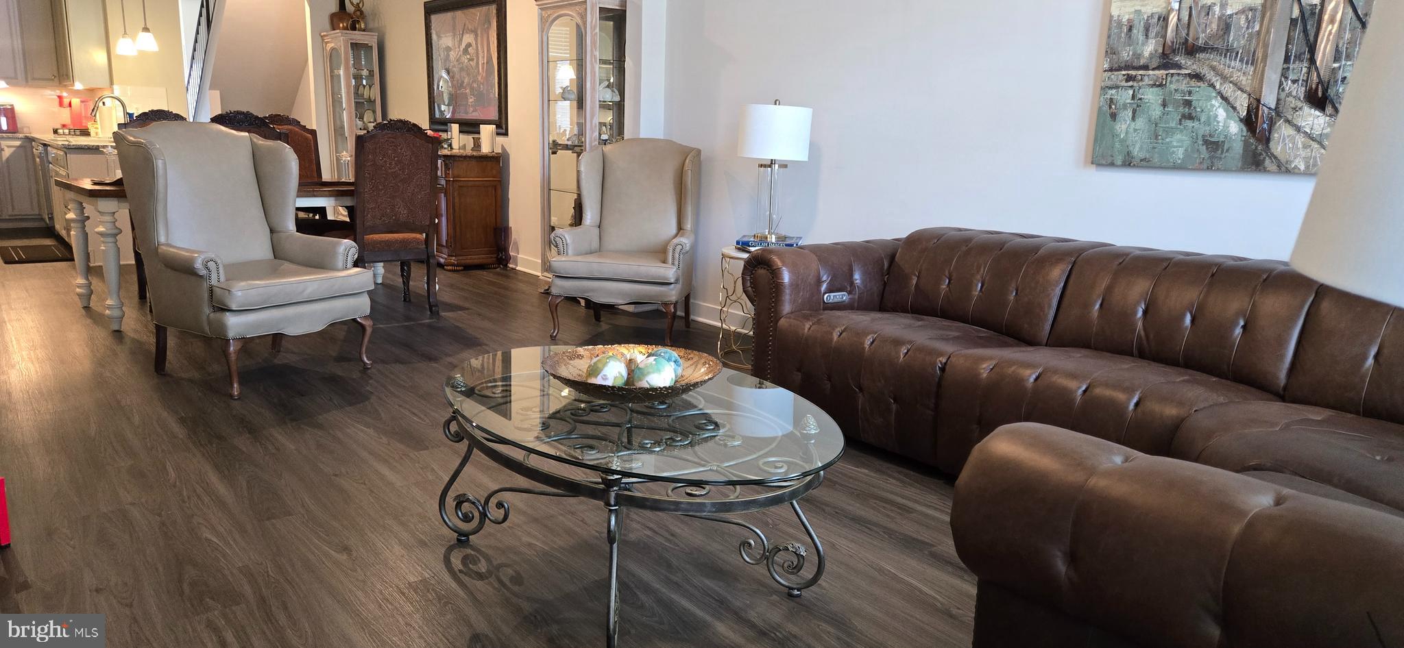 6005 Calla Place Frederick, MD 21703 - Photo 8 of 30 a living room with furniture a rug and a table