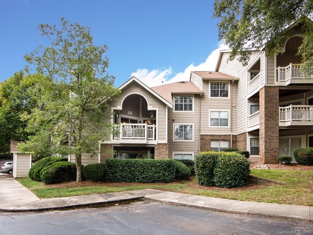 5003 Sharon Road, Unit B Charlotte, NC 28210 - Photo 1 of 20 a front view of a house with a yard