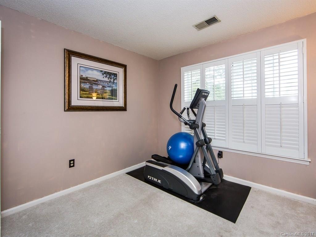 5003 Sharon Road, Unit B Charlotte, NC 28210 - Photo 14 of 20 a room with gym equipment and a window