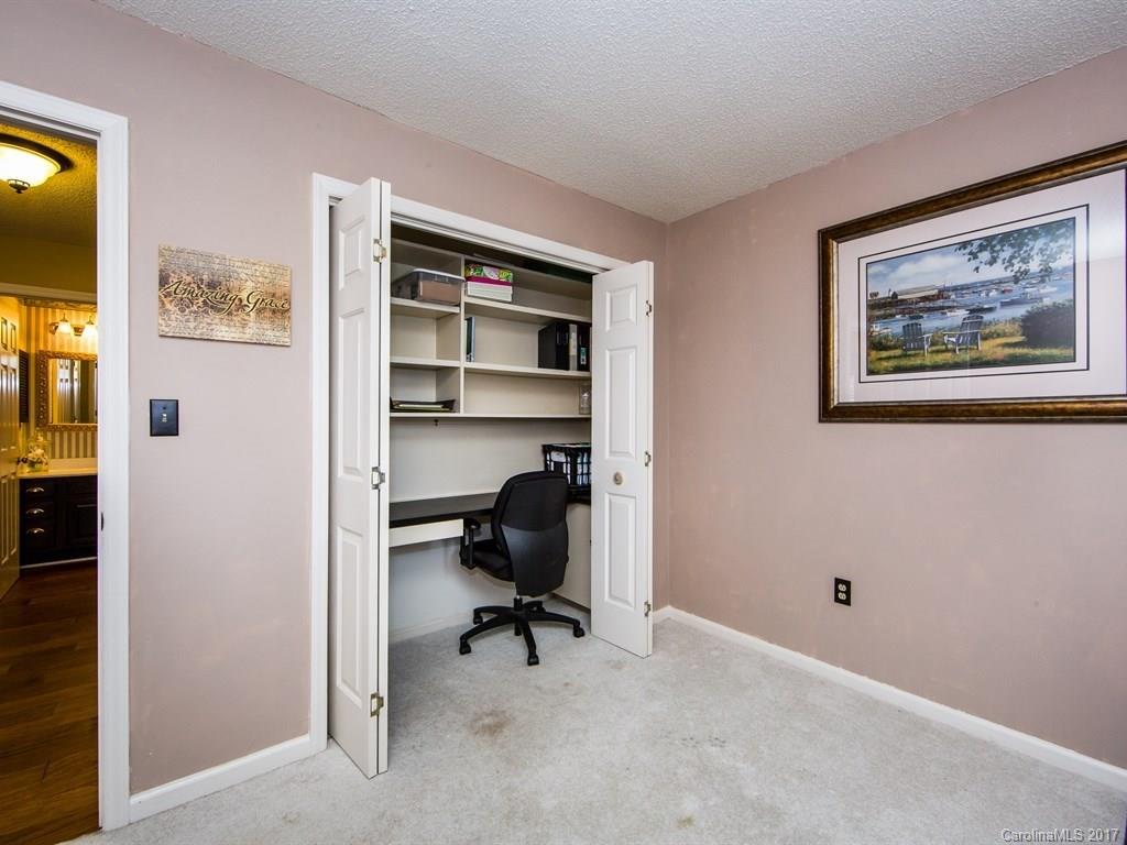5003 Sharon Road, Unit B Charlotte, NC 28210 - Photo 15 of 20 a view of a workspace with furniture and a window