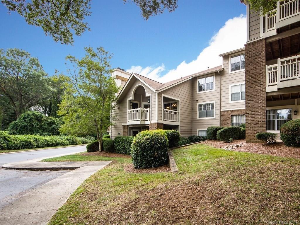 5003 Sharon Road, Unit B Charlotte, NC 28210 - Photo 19 of 20 a front view of a house with a yard