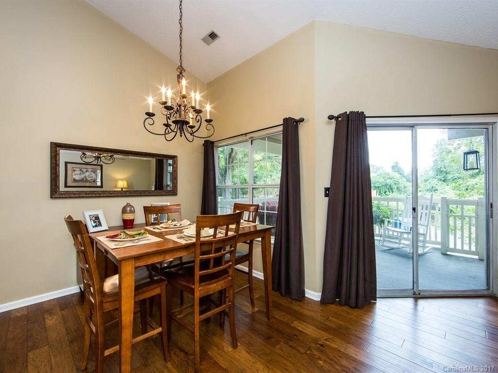 5003 Sharon Road, Unit B Charlotte, NC 28210 - Photo 6 of 20 a view of a dining room with furniture window and wooden floor