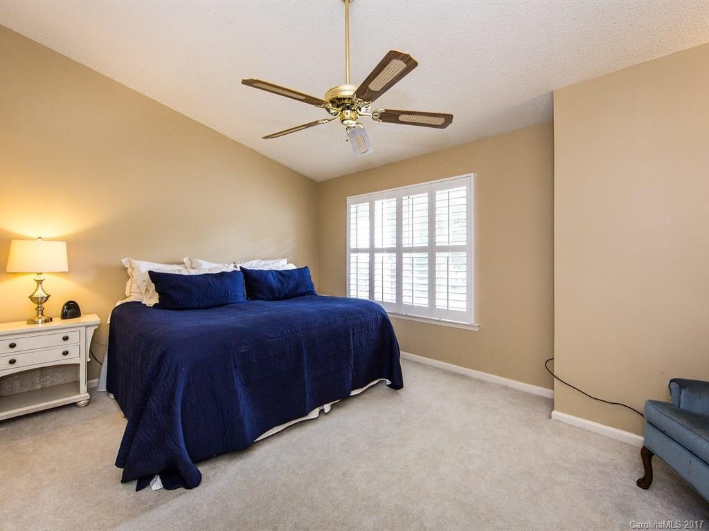 5003 Sharon Road, Unit B Charlotte, NC 28210 - Photo 10 of 20 a spacious bedroom with a bed and window
