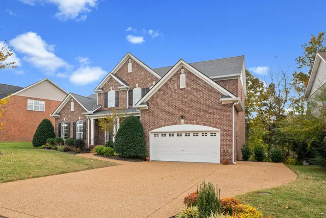 a front view of a building with garden