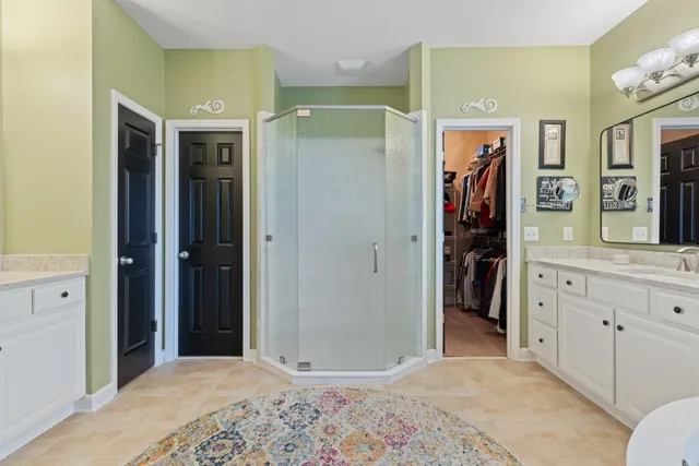 a bedroom with furniture and a ceiling fan