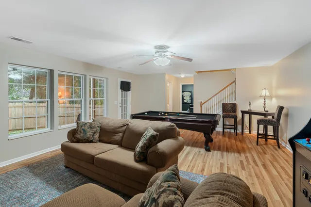 an aerial view of a house with a yard and outdoor seating