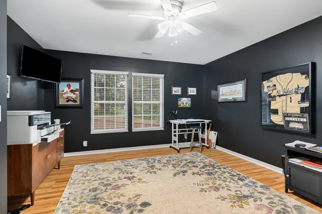 an aerial view of a house with garden space and street view