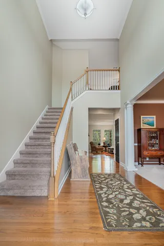 a dining room with furniture a chandelier and fireplace