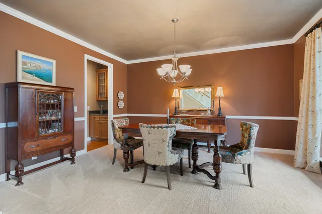 a living room with furniture fireplace and a table