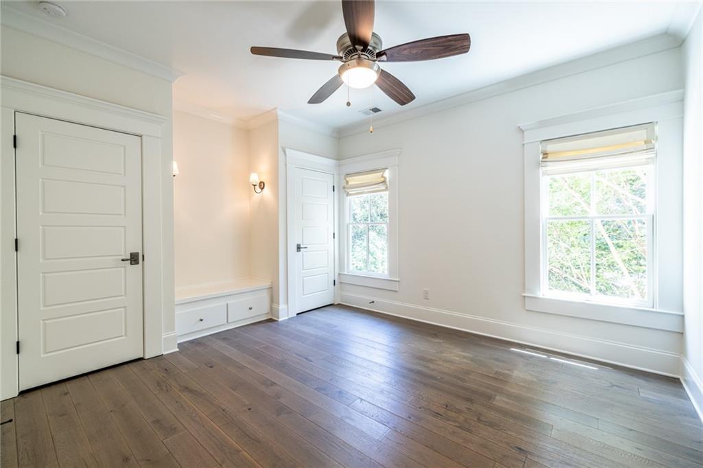 538 Ansley Street Decatur, GA 30030 - Photo 45 of 73 a view of an empty room with wooden floor and a window