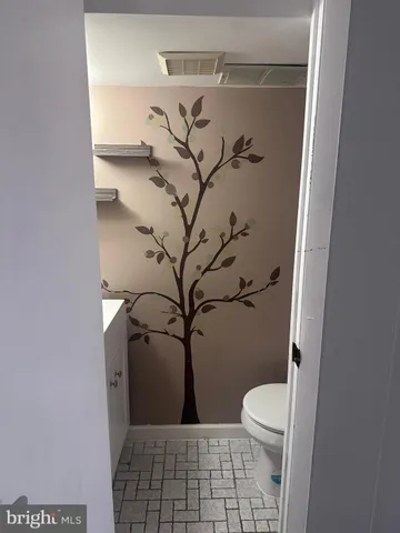 a view of storage and utility room with washer and dryer