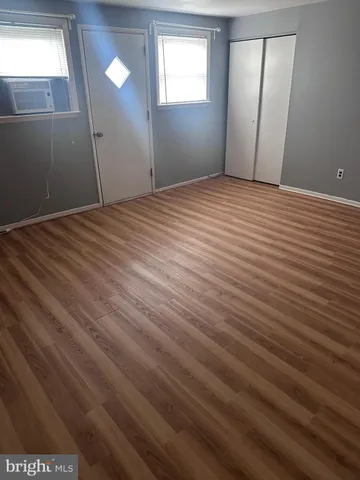 a view of a balcony with wooden floor