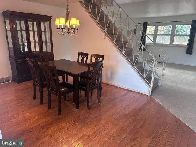 a view of a dining room with furniture and window