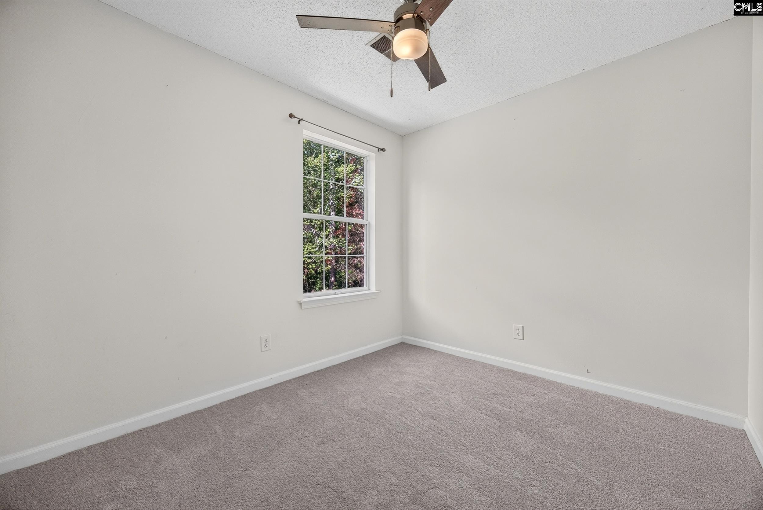 407 Sesqui Trail Columbia, SC 29223 - Photo 27 of 34 an empty room with a window and a fan