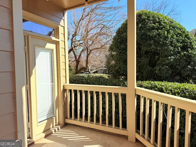 a view of a porch with a small yard