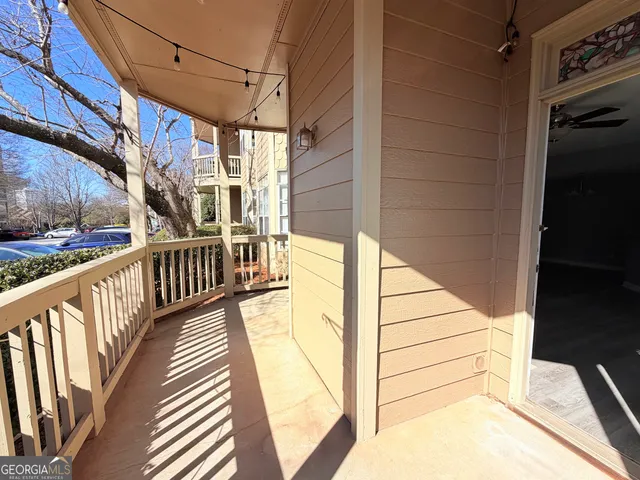 a view of balcony with wooden floor