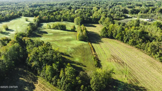 a view of a yard with an outdoor seating