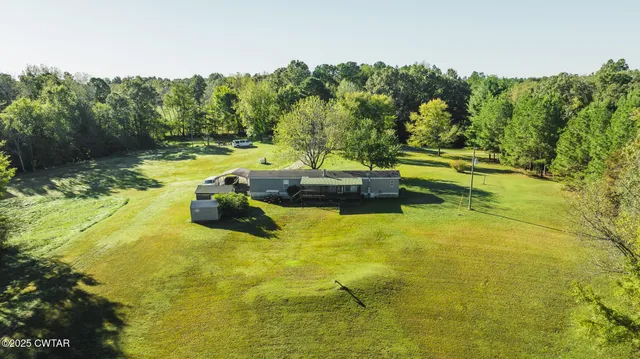 a view of residential houses with swimming pool