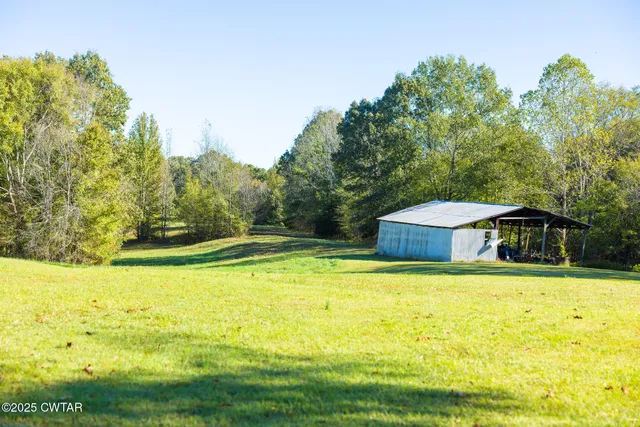 a view of a chair and table in the patio