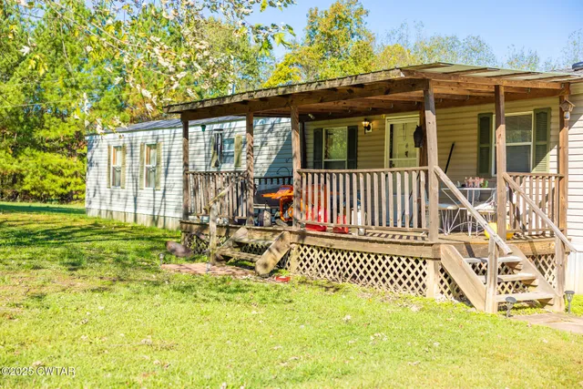a view of front door of house with an outdoor space