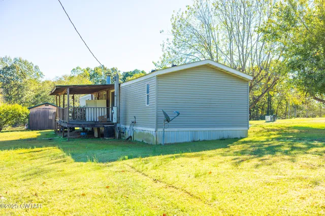 a house view with swimming pool in front of it