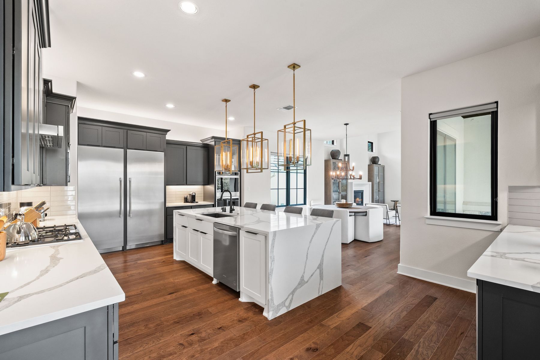 1106 Flint Ridge Trail Georgetown, TX 78628 - Photo 13 of 38 An open-concept kitchen boasts a grand central island, perfect for culinary endeavors and casual dining.